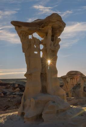 The Alien Throne Sunburst The sun seen though the Alien Throne Hoodoo in Valley of Dreams, New Mexico
