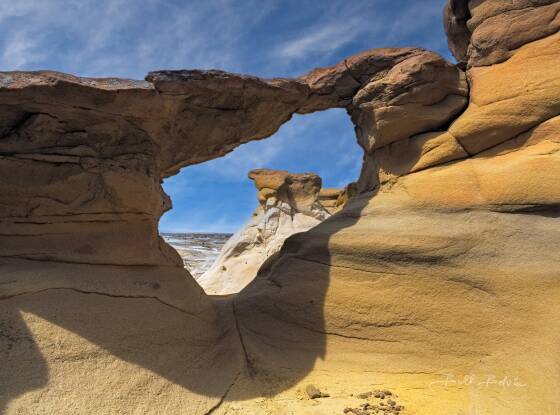 De-Na-Zin Arch De-Na-Zin arch on the rim above De-Na-Zin wash in the Bisti-De-Na-Zin wilderness
