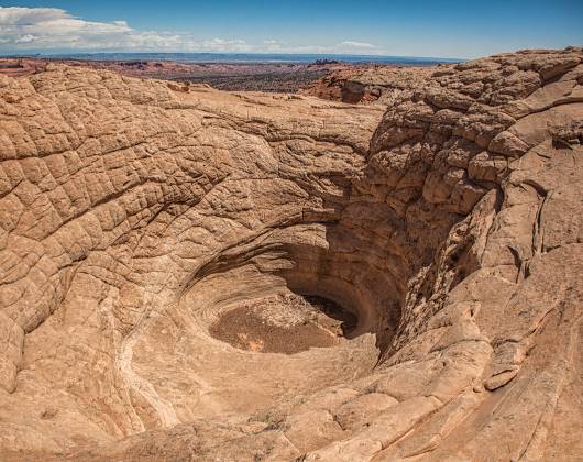 About 25 feet deep Sinkhole on Top Rock in Coyote Buttes North, Arizona