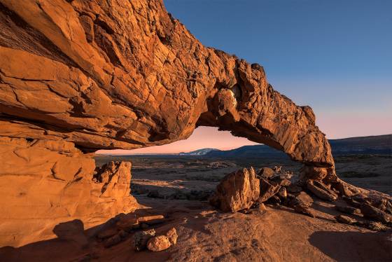 Sunset Arch framing Navajo Mountain Sunset Arch in Grand Staircase Escalante National Monument