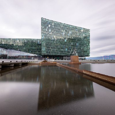 Harpa Concert Hall Harpa Concert Hall reflected in a pool in Reykjavik, Iceland