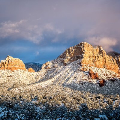 Sedona in the Snow Crown Butte and Gilbraltar rock \blanketed by a rare snowstorm at sunset in Sedona, AZ