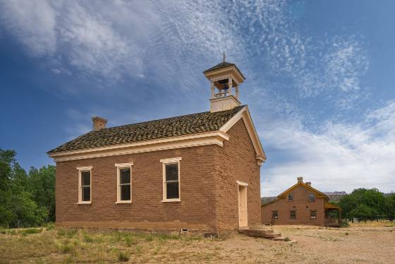Church and Russell House Church doubling as a schoolhouse in Grafton ghost town, Utah.Russell house in the background.