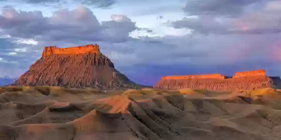 Early light on Factory Butte Factory Butte at dawn viewed from the hills near W Factory Road and Factory Butte Road