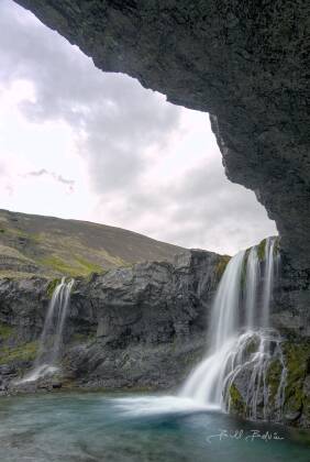 Skutafoss 3 Skutafoss waterfall seen from alcove on the river Þorgeirsstaðaá in Iceland.