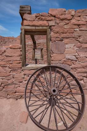 Wagon Wheel 1 Wagon wheel and windows of the Fort in Lees Ferry, Arizona