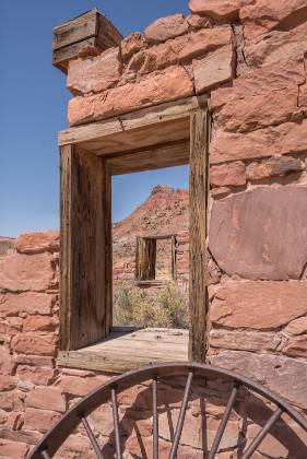 Wagon Wheel 2 Wagon wheel and windows of the Fort in Lees Ferry, Arizona