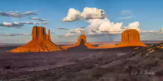 A Handshake Carved by Light The West Mitten's shadow falling on the East Mitten as seen at sunset from the Monument Valley Parking Lot. Merrick Butte adds balance to the image..