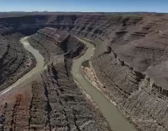 Mendenhall Loop 2 Mendenhall Loop, a bend in the San Juan River. Allhambra Rock and Monument Valley in the far distance.