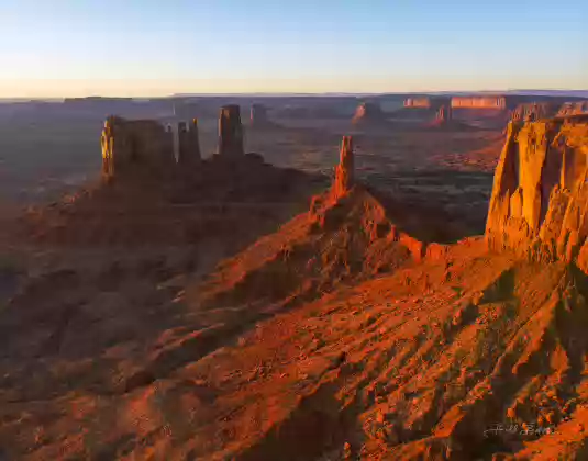 Stagecoach Butte 2 Aerial of Monument Valley showing from right to left Brigham Young's Tomb, King on his Throne, and Stagecoach Butte. Image taken at sunrise.