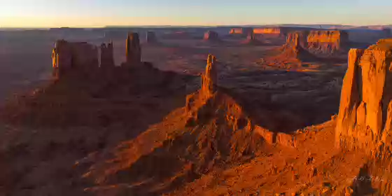 Stagecoach Butte 3 Aerial of Monument Valley showing from right to left Brigham Young's Tomb, King on his Throne, and Stagecoach Butte. Image taken at sunrise.