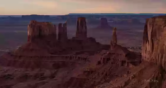 Stagecoach Butte before Sunrise Aerial of Monument Valley showing from right to left Brigham Young's Tomb, King on his Throne, and Stagecoach Butte. Image taken at sunrise.
