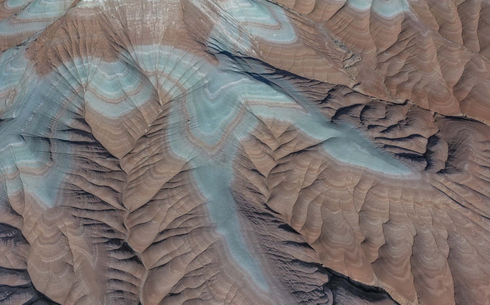 Aerial shot of the blueish badlands of Eastern Arizona.