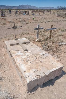 Broken Cross replaced by Rebar Broken Cross lying on ledger replaced by a rebar cross in the Pearce cemetery, Arizona