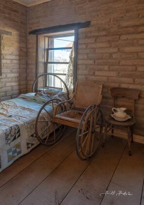 Wheelchair Wheelchair seen in the doctor's office in Vulture City ghost town, Arizona.