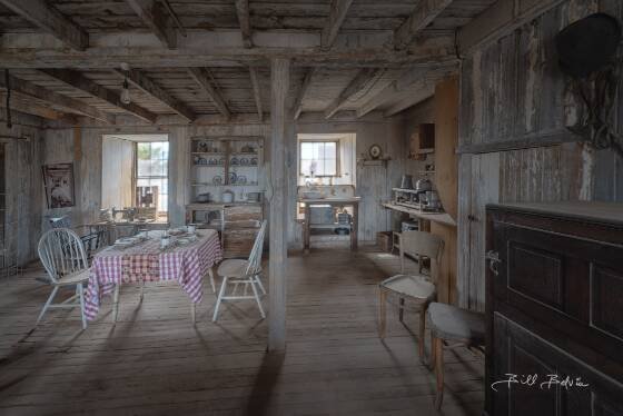 Assay Office Rocking Chair and Sewing Machine seen in Vulture City ghost town, Arizona.
