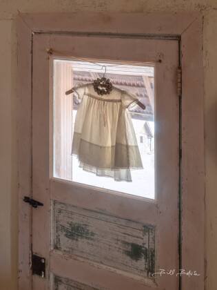 Childs Dress Childs dress seen in the brothel in Vulture CIty ghost town, Arizona.