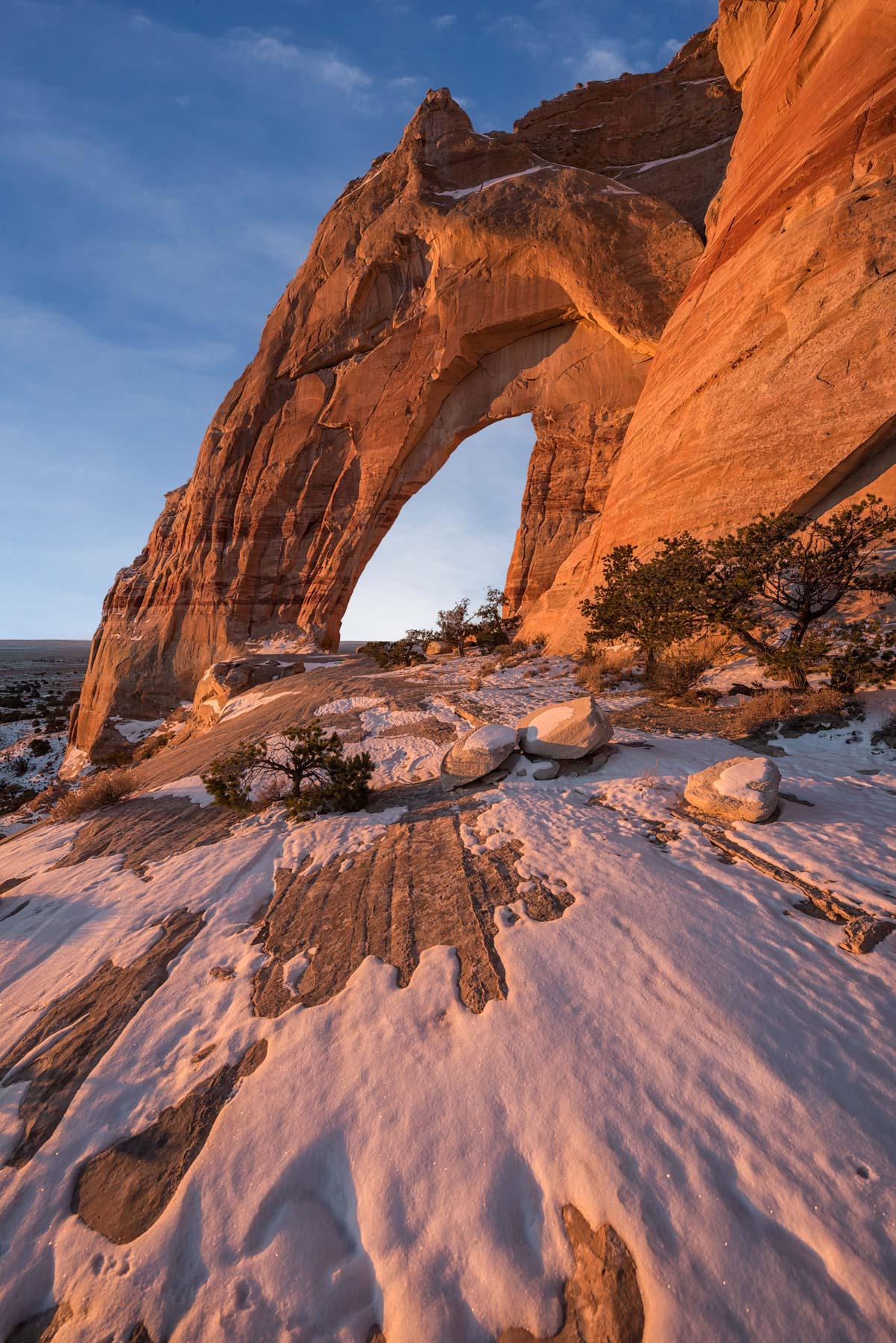 Patchy snow at White Mesa Arch in the Navajo Nation